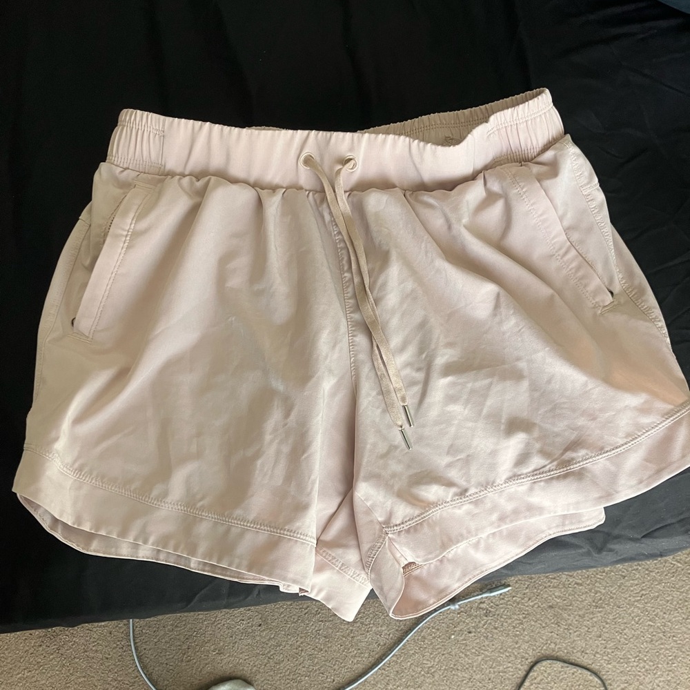 Medium cream/tanish athletic shorts with pockets and adjustable waistband